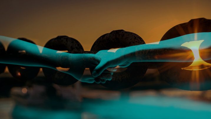 Empathy, joined hands over a chain