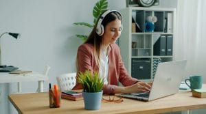Blended Learning - Girl with laptop and headset