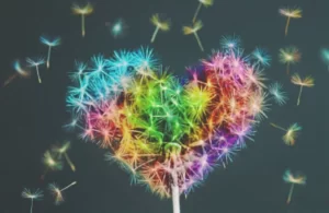 Career Paths - A dandelion is blowing wishes in the shape of a heart.